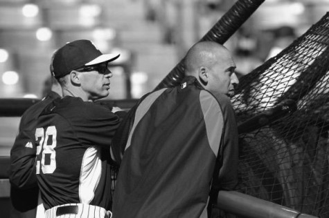 Derek Jeter (right) and Joe Girardi (left) watch practice prior to a 2014 spring training game. Jeter announced his retirement in February that this will be his last season. His 20 year career in the MLB and New York Yankees will come to an end.  