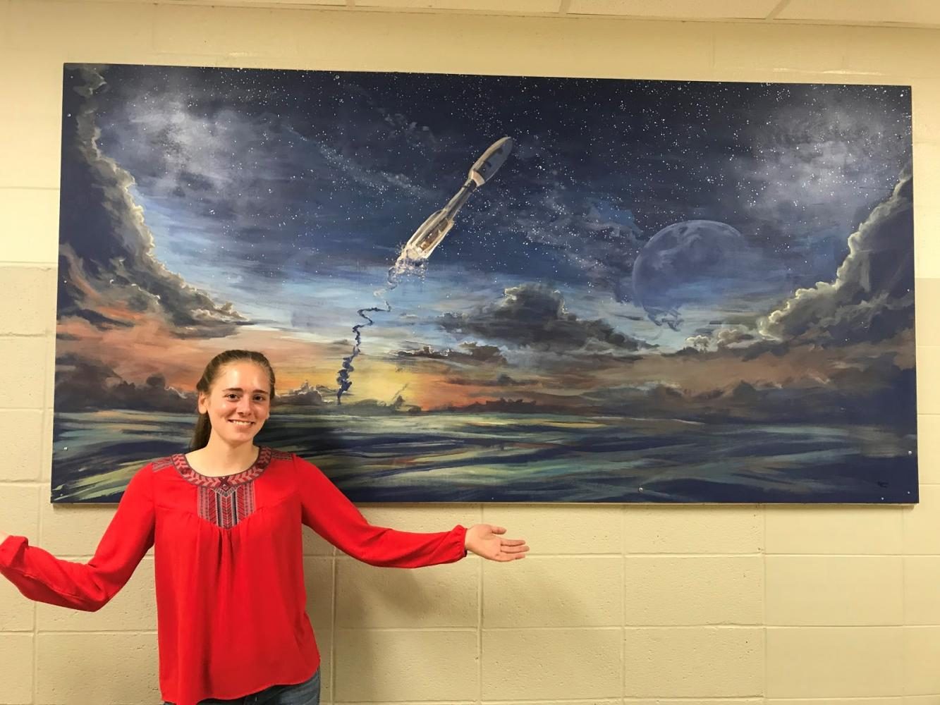 Departing Hawk leaves her mark: Parks paints mural for science hallway