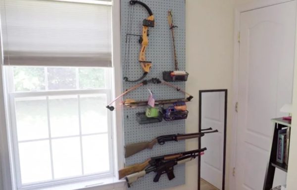 Baltimore County fifth-grader keeps BB guns, airsoft guns, and bows mounted 
on his wall. He had learned how to shoot them and had taken three levels of archery 
lessons in pursuit of becoming an Eagle Scout in Boy Scouts.
Photo Credit: Chris Papst

