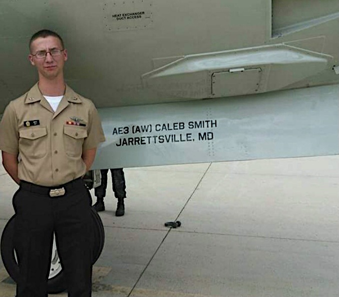 North Harford alumnus Caleb Smith, now an aviation electrician in the United States Navy standing next to plane as Plane Captain
Photo credit: Caleb Smith