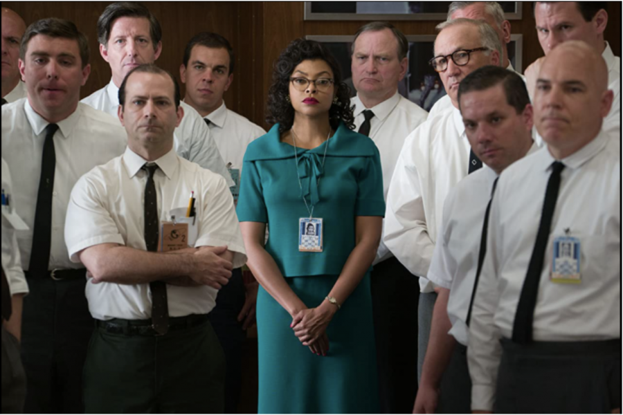 Katherine Jonson played, by Taraji P. Henson, stands among her co-works listening to an announcement while at work. The movie ‘Hidden Figures’ is based off real events that happened in 1961.  
