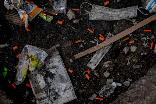 Used needles and narcan sprays engulf Kensington Avenue. The area is known for drug use, prostitution, and homelessness. PHOTO CREDIT: Hilary Swift
