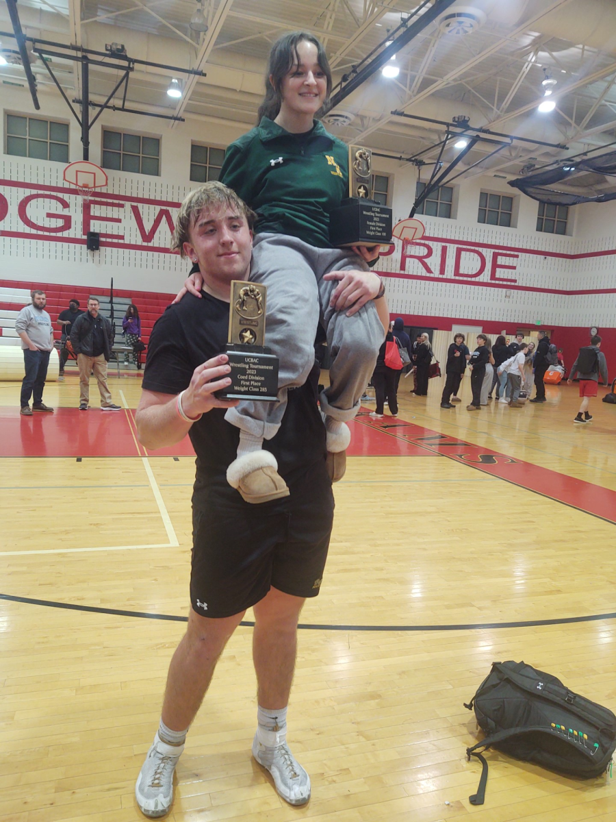   Senior Clay Lawrence and junior Bryn Cespedes celebrate after their UCBAC tournament wins. This meet took place at Edgewood High School.

