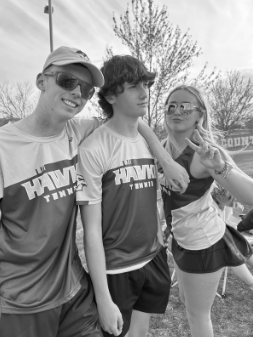 Sophomore Eric Valenza hangs out with Harrity and Manns. The team celebrated a 8-1 win against Elkton that day. 
PHOTO CREDIT: Emily Johnson
