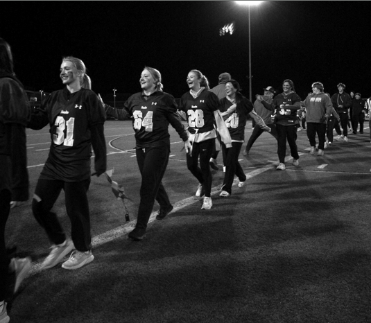 The juniors had big smiles after their victory over seniors. The juniors and seniors line up to congratulate each other after the game. 